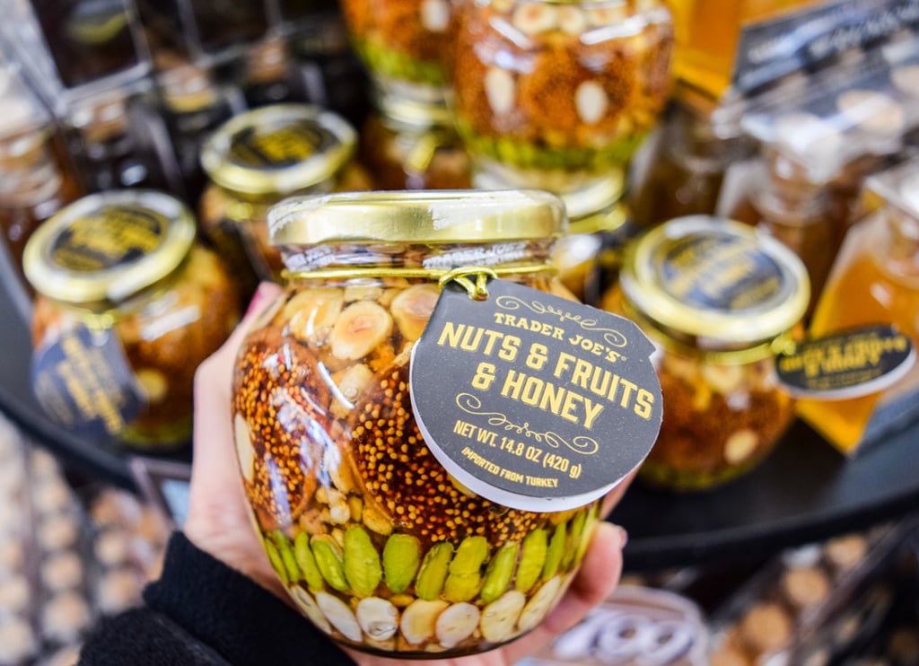 glass jar, dried fruits and nuts are drenched in sweet honey